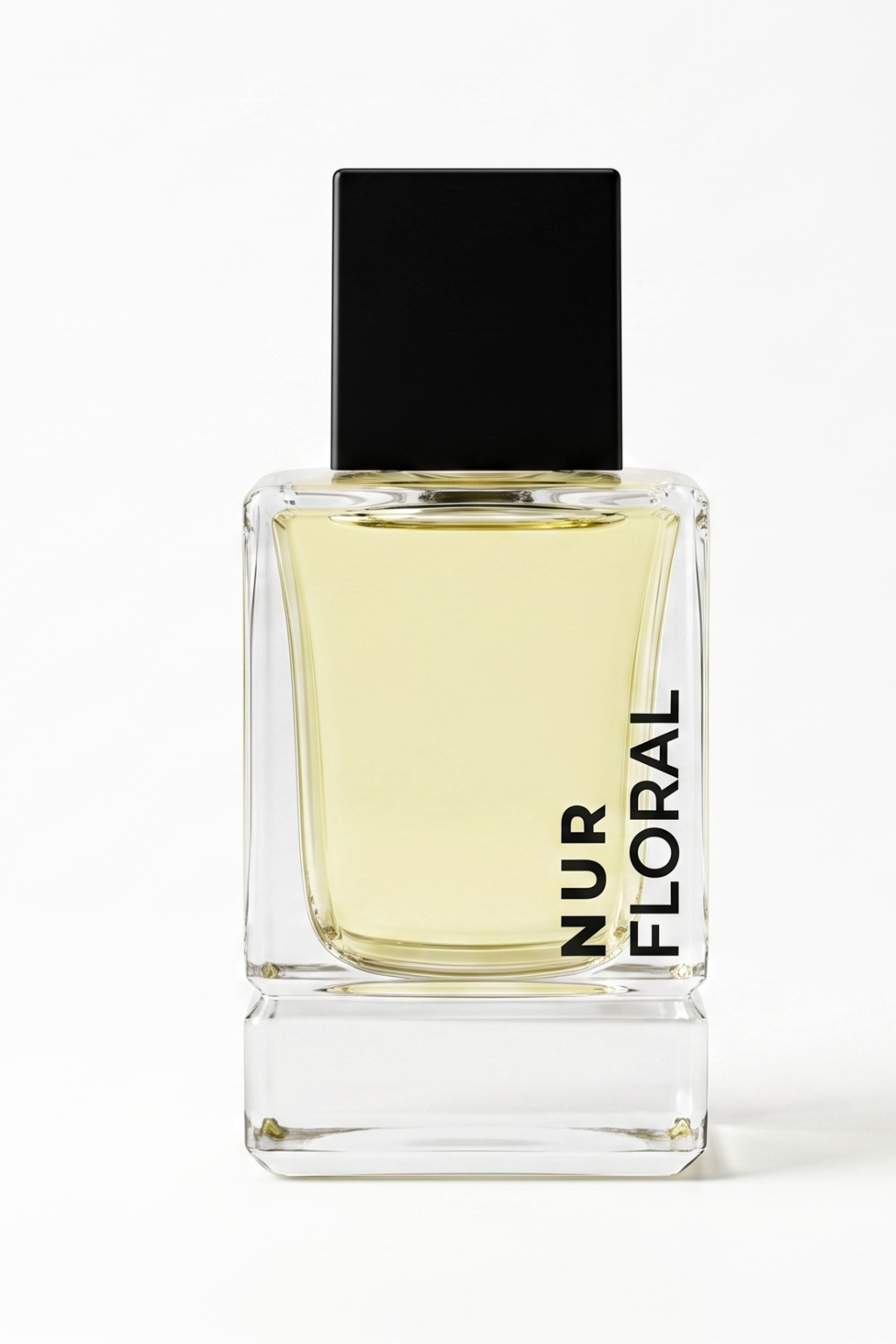 A rectangular glass perfume bottle filled with pale yellow liquid, featuring a matte black cap and vertical black text reading 'NUR FLORAL' on the front, set against a plain white background.
